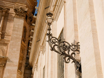 Low angle view of street lamp on wall