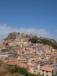 Buildings in town against sky