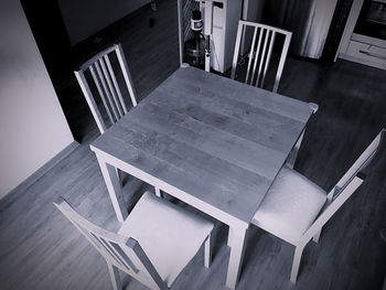 High angle view of empty chairs and table in restaurant