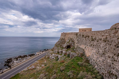 Scenic view of sea against cloudy sky