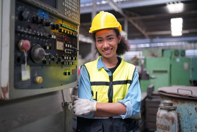 Portrait of engineer standing in factory