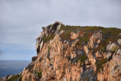 Majestic rock formation against sea