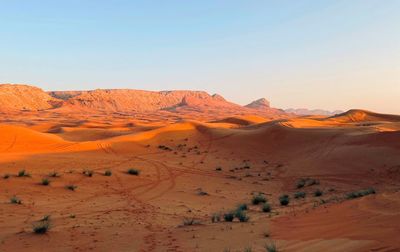 Scenic view of desert against clear sky