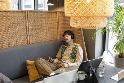 Young man relaxing in cafe