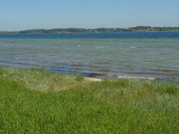 Scenic view of sea against clear sky