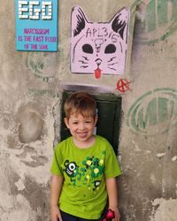 Portrait of smiling boy with text