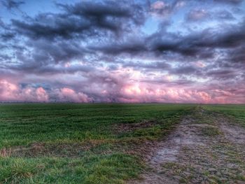 Scenic view of landscape against cloudy sky