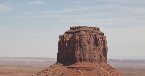 Rock formations on landscape against sky