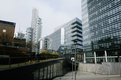 Buildings in city against sky