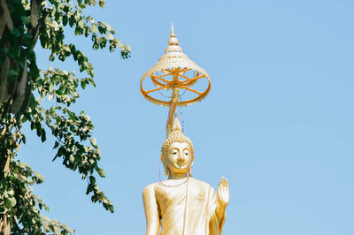 Low angle view of statue against sky