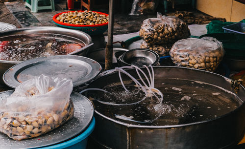 A vibrant and lively market scene filled with an array of seafood and fresh produce on display