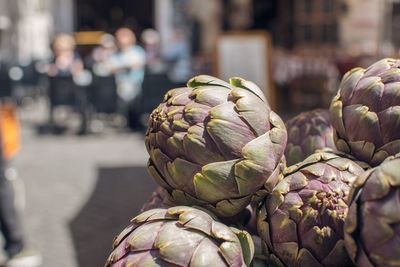 Close-up of artichokes in market for sale