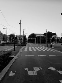 Empty road against clear sky