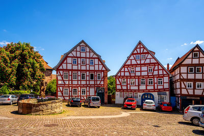 View of buildings against blue sky