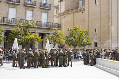 Pledge of alliegance. people in front of a building