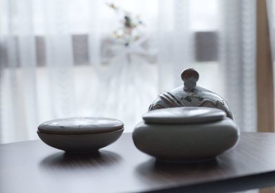 Close-up of crockery on table