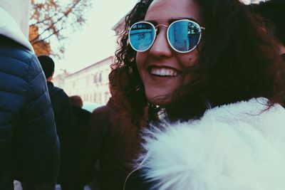 Portrait of smiling teenage girl in sunglasses