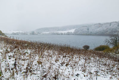 Scenic view of frozen lake against sky