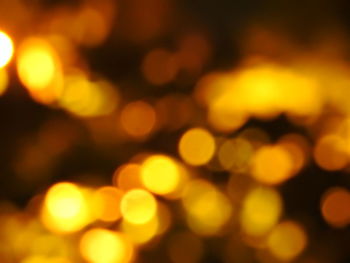Defocused image of illuminated lights at night