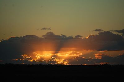 Scenic view of silhouette landscape against sky during sunset