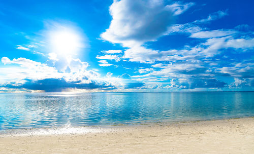 Scenic view of sea against blue sky