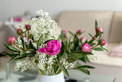 Close-up of pink flowers on table