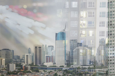 Buildings in city against sky