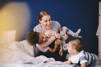 Side view of a smiling girl with toy