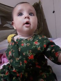 Portrait of cute baby girl at home