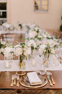 Close-up of flowers in glass on table