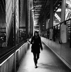 Full length of man walking on bridge