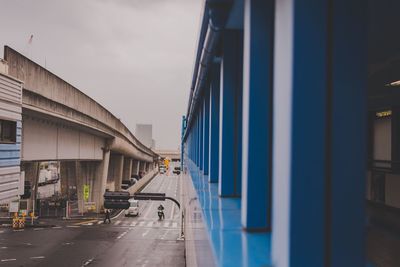 Cars on road against sky