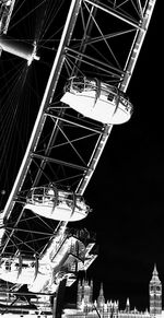 Low angle view of illuminated ferris wheel