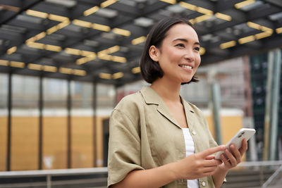 Young woman using mobile phone