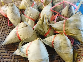 High angle view of rice dumplings on wicker basket