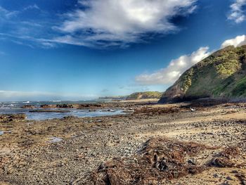 Scenic view of beach against sky