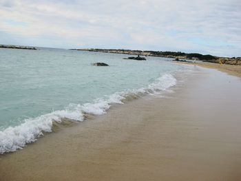 Scenic view of beach against sky