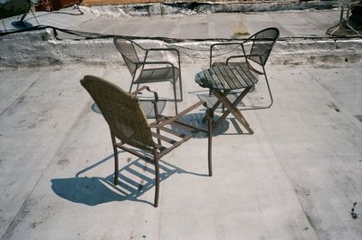 High angle view of empty chair on table during winter