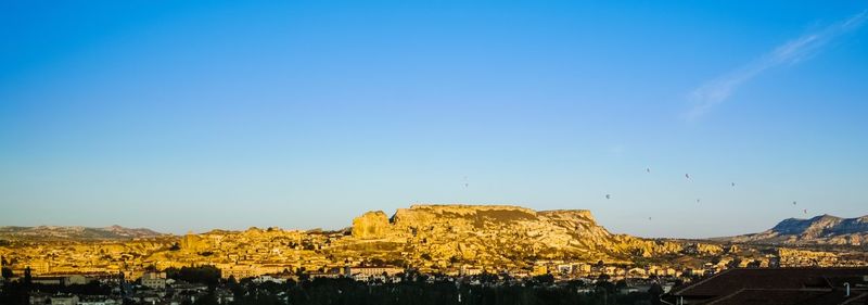 View of city against clear blue sky