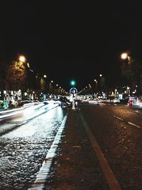 View of illuminated street at night