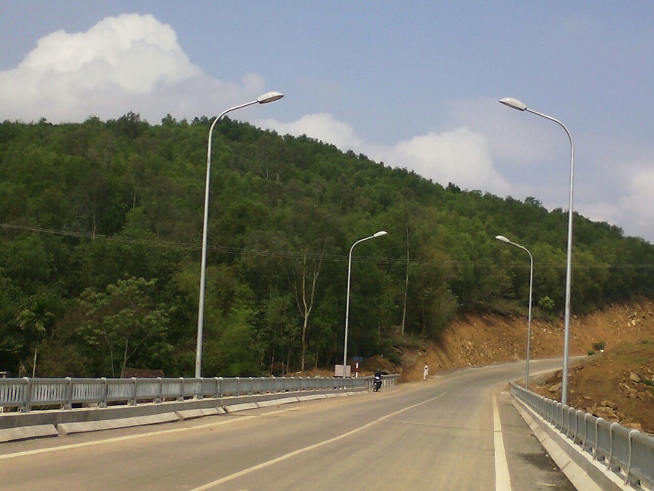 road, transportation, the way forward, road marking, sky, diminishing perspective, street light, vanishing point, tree, cloud - sky, country road, street, car, mountain, empty road, cloud, asphalt, empty, outdoors, highway