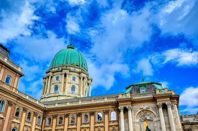 Low angle view of cathedral against cloudy sky