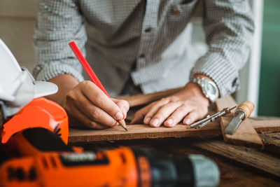 Close-up of man working on table