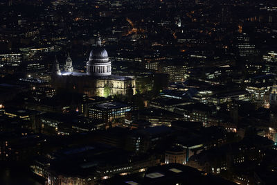 High angle view of illuminated st paul cathedral amidst city at night