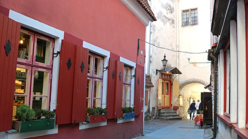 Narrow street amidst buildings in city