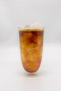 Close-up of drink against white background