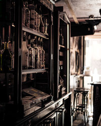 Row of bottles on display at a bar counter