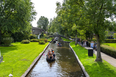 Giethoorn, netherlands - 13 september 2020. tourists sailing on rented boats on the canal.