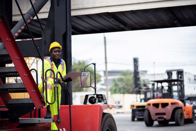 Portrait of man working at bus