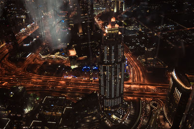 High angle view of illuminated buildings in city at night